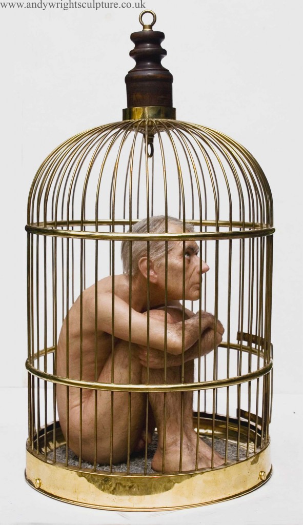 Nude caged man looking resigned - realisitic miniature sculpture. Made from silicone, resin, hair and brass cage
